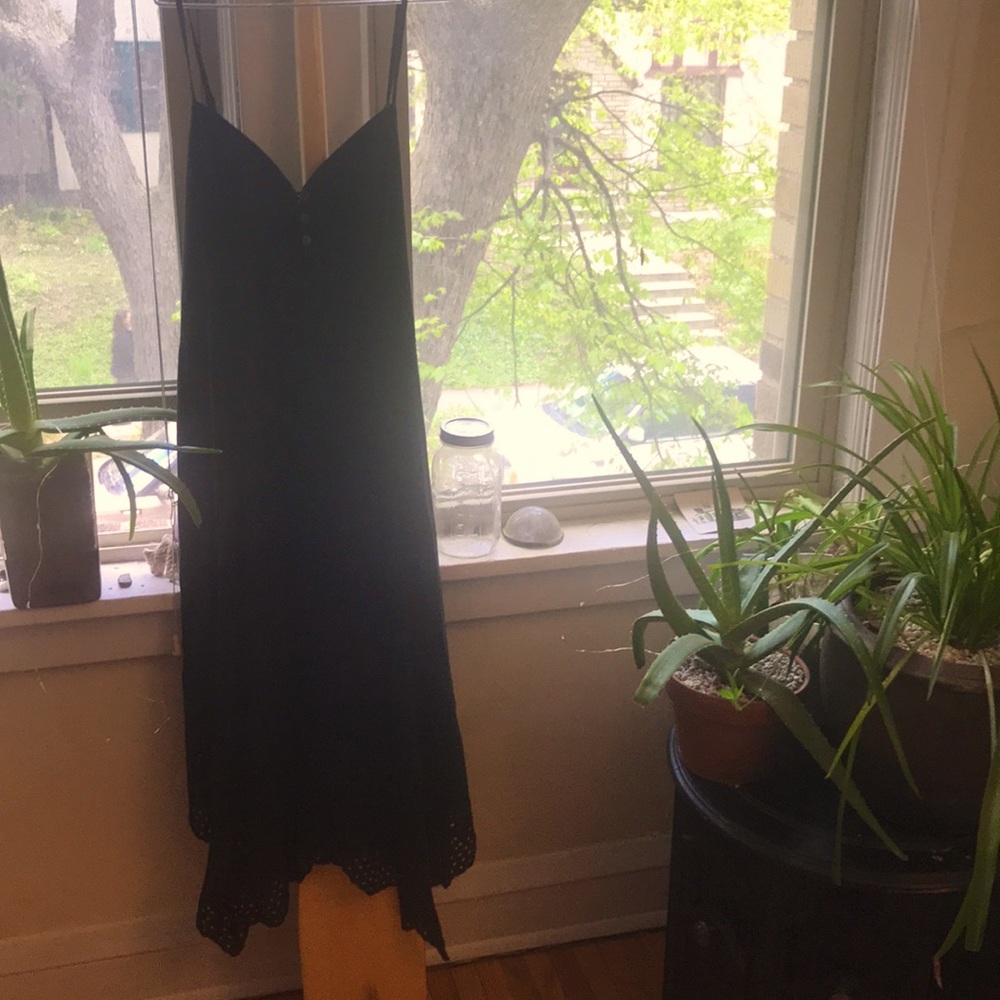 Strappy little black dress with islet hem! 👗